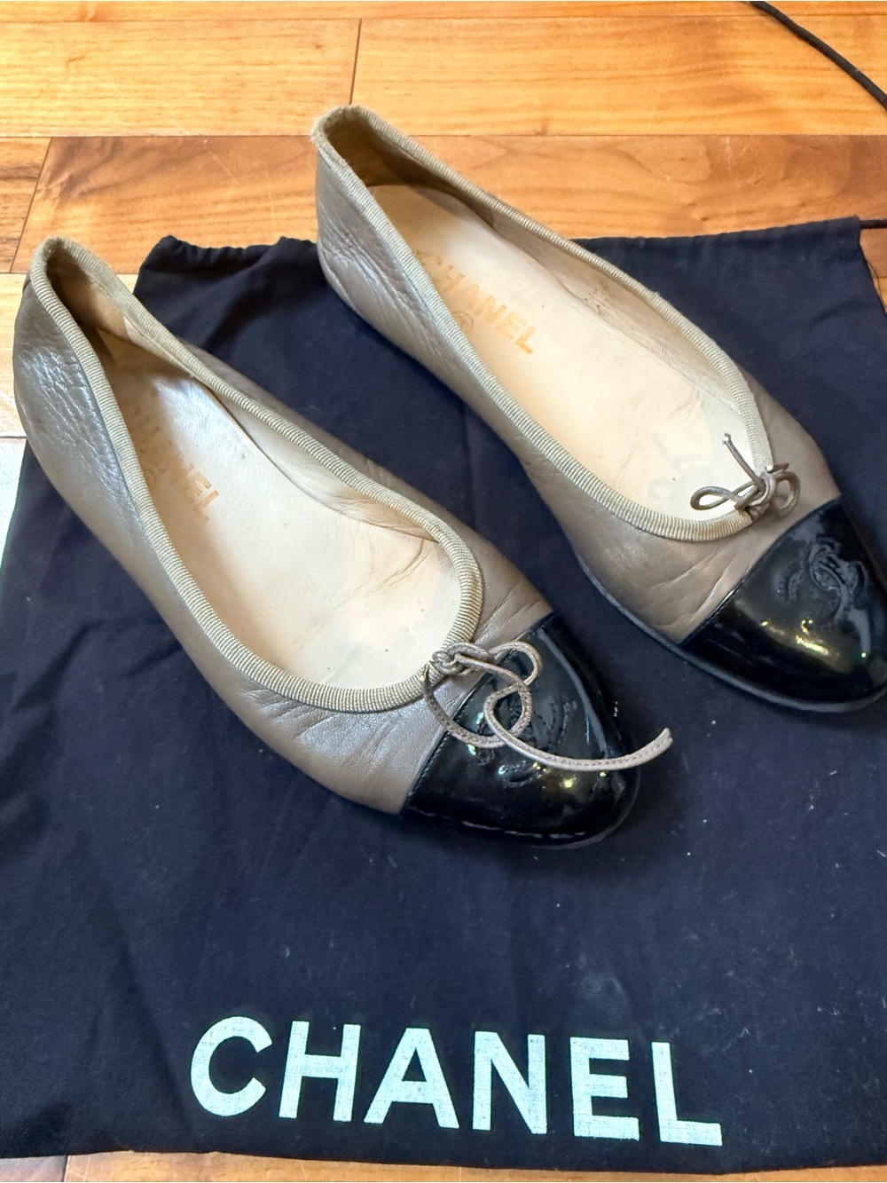 CHANEL Taupe Leather Ballet Flats with Black Patent Cap Toe & Bow